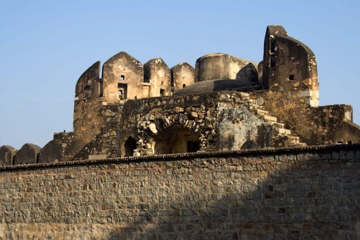 Top portion of the Fort seen behind wall, Jhansi, Uttar Pradesh, India, Asia