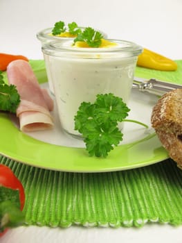 Egg on herb cream cheese in a glass