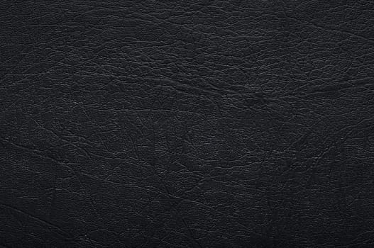 Dark background or texture (leather).