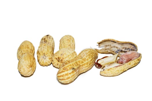 five pieces of peanuts, one piece is cracked, isolated on white background.