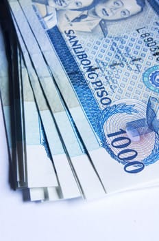 a stack of philippines peso, in one thousand denomination