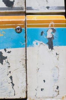 grunge background of metal plate with keyhole, retro style paints.