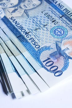 a stack of philippines peso, in one thousand denomination