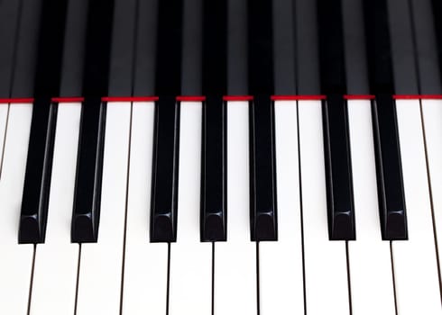 Close up image of the keys of a grand piano