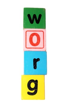 assorted childrens toy letter building blocks against a white background that spell grow with clipping path