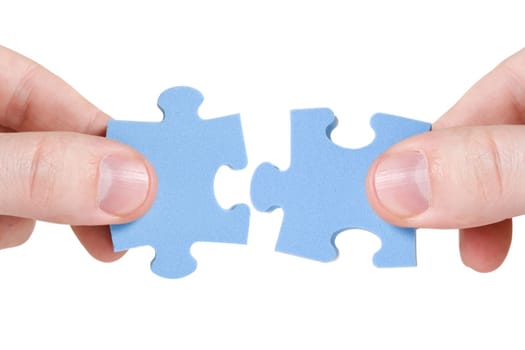 teamwork concept. two hands with different pieces of puzzle