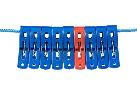 clothesline with a clothes pegs. Blue ones and one red