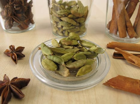 Spice jars with cardamom,cinnamon and star anise