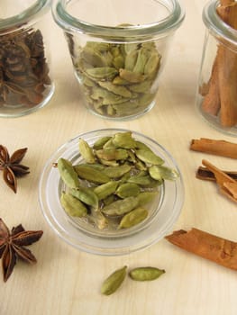 Spice jars with cardamom,cinnamon and star anise