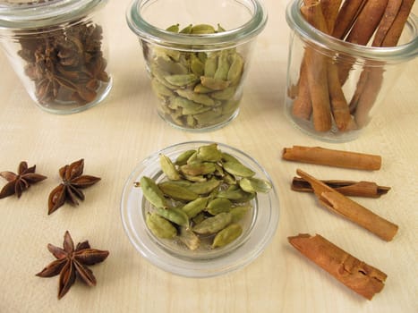 Spice jars with cardamom,cinnamon and star anise