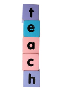assorted childrens toy letter building blocks against a white background that spell teach with clipping path