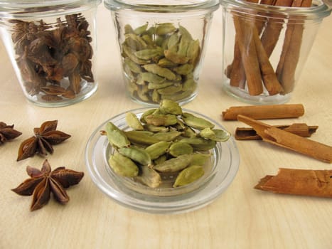 Spice jars with cardamom,cinnamon and star anise