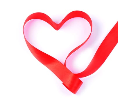 Close-up of a ribbon made red hearth with copy space.