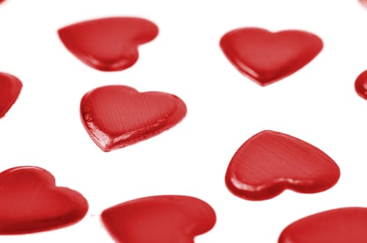 Red hearts confetti isolated on white background