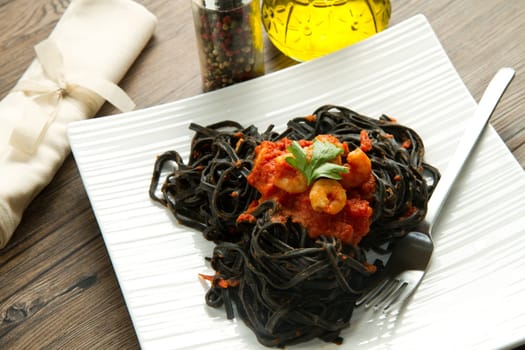 black pasta  with tomatoes sauce and shrimp