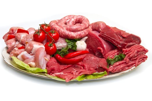 Fresh butcher cut meat assortment garnished