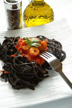 black pasta  with tomatoes sauce and shrimp