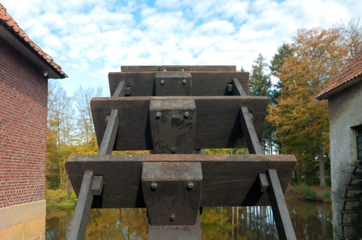 closeup of a wheel of an old water powered sawmill in the Netherlands