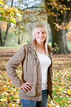 Laughing teenager in autumn park
