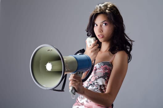 Beautiful young lady posing with a speaking-tube