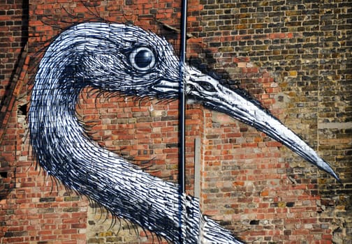 Bird graffiti on a brick wall in London
