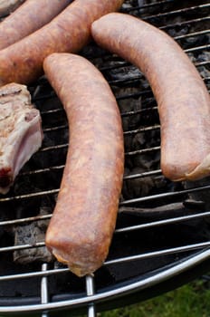 Sausages cooking on the grill