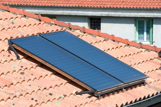 Heat solar water installed on a roof of Anduze, French city in the south-east of France.