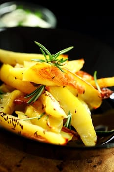 Baked potatoes with cheese dip and rosemary