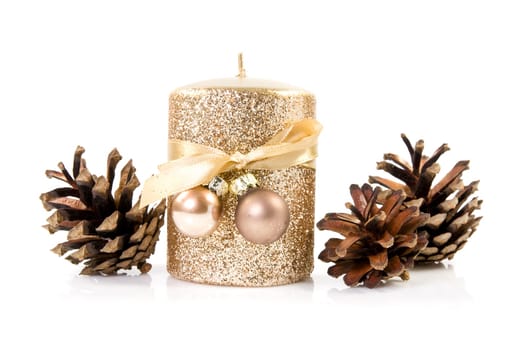 Gold candle with the baubles and cones
