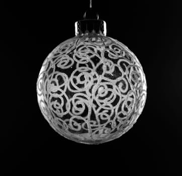 Single round globe glass xmas decoration against black