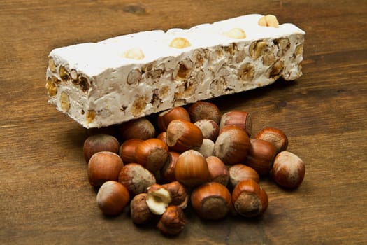 nougat with hazelnut on wooden table
