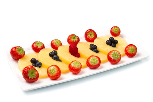 pineapple slices with berries