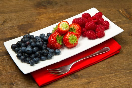 fresh berries on wooden background