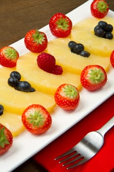 pineapple slices with berries