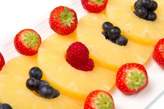 pineapple slices with berries