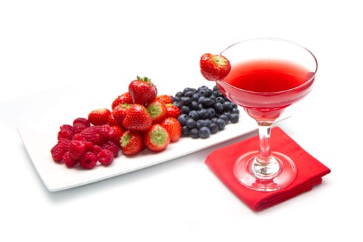 fruit juice with berries on white background