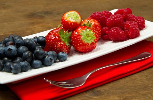 fresh berries on wooden background