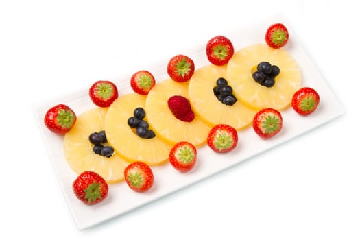 pineapple slices with berries