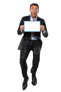 one caucasian surprised business man  jumping holding showing whiteboard in studio isolated on white background