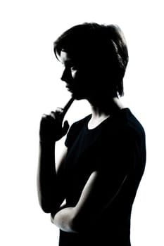 one caucasian young teenager silhouette boy or girl thinking portrait in studio cut out isolated on white background
