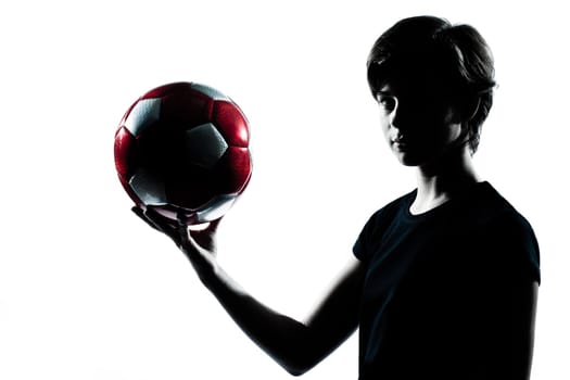 one caucasian young teenager silhouette boy girl holding showing soccer football portrait in studio cut out isolated on white background