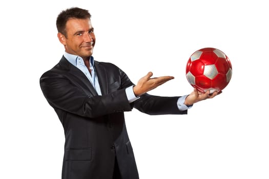 one caucasian business man holding showing soccer ball in studio isolated on white background