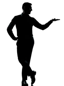 one caucasian business man silhouette standing hand open  Full length in studio isolated on white background