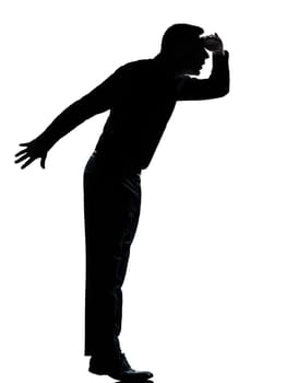one caucasian business man silhouette standing tiptoe looking away Full length in studio isolated on white background