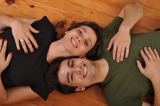 lovely friendship between sister and brother lying and relaxing on the floor
