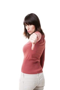 Beautiful woman with thumbs down, isolated against a white background