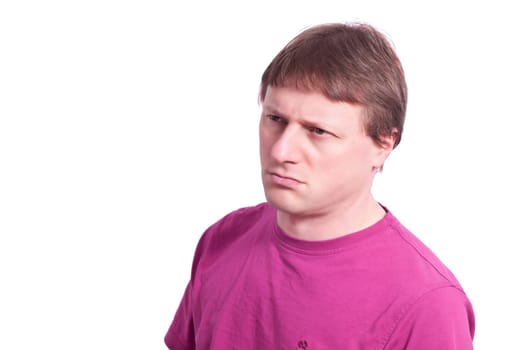 Man with brown hair looks skeptical