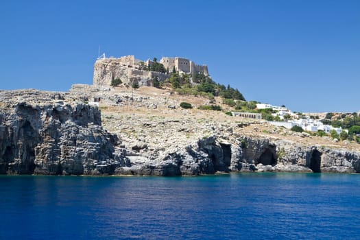 Landscape of Lindos acropolis.  Ancient Temple ruins and blue sky and ocean