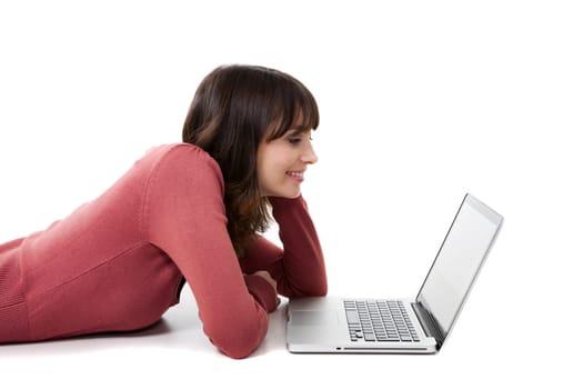 Beautiful woman with a laptop in studio with white background