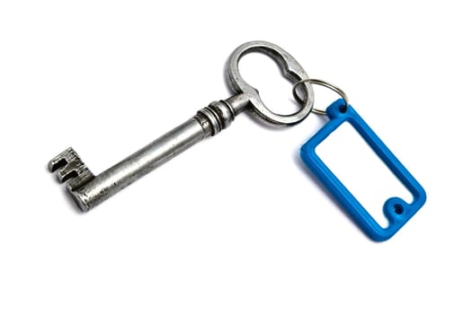 Blank tag and old key isolated on white background